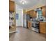 Bright kitchen with stainless steel appliances, tile floors, and tile backsplash at 4009 Olde Coach Rd, Durham, NC 27707