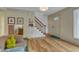 Bright and airy living room featuring hardwood floors and a staircase nearby at 4009 Olde Coach Rd, Durham, NC 27707