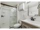 Modern bathroom with glass shower, sleek vanity, and clean white finishes at 4645 Edwards Mill Rd, Raleigh, NC 27612