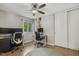 Functional bedroom featuring two desks, office chairs, and natural light at 4645 Edwards Mill Rd, Raleigh, NC 27612