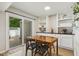 Cozy dining area featuring a table for four, built-in shelving, and sliding door access at 4645 Edwards Mill Rd, Raleigh, NC 27612