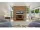 Bright living room with wood accent wall, hard floors and sliding door access to the exterior at 4645 Edwards Mill Rd, Raleigh, NC 27612