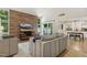 Living room with stylish furniture and view into dining area with built in cabinets at 4645 Edwards Mill Rd, Raleigh, NC 27612