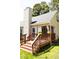 Exterior shot of a back deck featuring stairs, railing, and a covered area at 4905 Knightsbridge Way, Raleigh, NC 27604