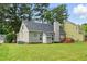 Home's exterior reveals a spacious backyard with a deck, ideal for entertaining at 4905 Knightsbridge Way, Raleigh, NC 27604