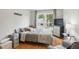 Cozy bedroom with a large window and neutral decor at 4905 Knightsbridge Way, Raleigh, NC 27604