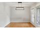 Dining room with modern lighting and glass doors providing plenty of natural light at 4905 Knightsbridge Way, Raleigh, NC 27604