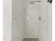 Modern tiled shower with rainfall shower head and mosaic tile floor at 4905 Knightsbridge Way, Raleigh, NC 27604