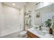Bathroom features a shower-tub combo, stylish fixtures, and a decorative mirror at 507 N Elm St, Durham, NC 27701