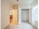This bedroom features plush carpeting, closet, and natural light from the window at 507 N Elm St, Durham, NC 27701