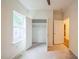 Bright bedroom features plush carpeting, closet, and natural light from the window at 507 N Elm St, Durham, NC 27701