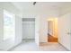 Bright bedroom features an open closet and a window bringing in natural light at 507 N Elm St, Durham, NC 27701