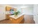 Modern kitchen featuring an island, stainless steel appliances, and plenty of counter space at 507 N Elm St, Durham, NC 27701