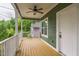 Charming porch with wooden floors, a ceiling fan, and a view of the neighborhood at 507 N Elm St, Durham, NC 27701