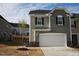 Charming two-story home with a two-car garage and appealing exterior color scheme at 526 Catalina Grande Dr, Cary, NC 27519