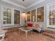 Inviting brick back porch with patio furniture, perfect for relaxing at 5401 Fire Pink Way, Raleigh, NC 27613