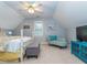 Bedroom with chair and stylish furniture under a ceiling fan at 5401 Fire Pink Way, Raleigh, NC 27613
