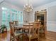 Spacious dining room featuring a round table with seating for eight and a view to the living room at 5401 Fire Pink Way, Raleigh, NC 27613