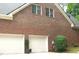 Two-car garage and brick exterior at 5401 Fire Pink Way, Raleigh, NC 27613