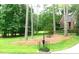 Well-manicured front yard with mature trees and established landscaping at 5401 Fire Pink Way, Raleigh, NC 27613