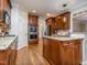 Well-appointed kitchen boasts custom cabinets, stainless steel appliances, and granite countertops at 5401 Fire Pink Way, Raleigh, NC 27613