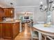 View of breakfast nook and living room from kitchen island featuring natural light from many windows at 5401 Fire Pink Way, Raleigh, NC 27613