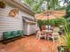 Outdoor patio area featuring a round table and chairs, complete with an umbrella at 5401 Fire Pink Way, Raleigh, NC 27613