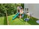 Backyard with a wooden playset and a large green lawn perfect for outdoor activities at 6 Beaver Creek Lane Ln, Durham, NC 27703