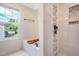 Bright bathroom featuring a tub with black fixtures, shower with decorative tile, and a window providing natural light at 6 Beaver Creek Lane Ln, Durham, NC 27703