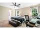 Bright bedroom with three windows and a ceiling fan, plus a home office area at 6 Beaver Creek Lane Ln, Durham, NC 27703