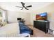 Bedroom featuring a ceiling fan, large television, and a work space at 6 Beaver Creek Lane Ln, Durham, NC 27703