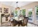 Dining area with a wooden table, modern light fixture, and plenty of natural light at 6 Beaver Creek Lane Ln, Durham, NC 27703