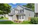 Home featuring a two-car garage, stone accents, and a well-manicured lawn at 6 Beaver Creek Lane Ln, Durham, NC 27703