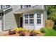 Exterior of home showcasing landscaped yard and bay window at 6 Beaver Creek Lane Ln, Durham, NC 27703