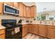 Bright kitchen with light wood cabinets, modern appliances, and plenty of counter space at 6 Beaver Creek Lane Ln, Durham, NC 27703