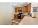 Well-lit kitchen featuring wood cabinets, stainless steel appliances, and light countertops at 6 Beaver Creek Lane Ln, Durham, NC 27703