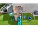 Aerial shot of backyard with swing set, slide, and climbing area on a lush green lawn, perfect for Gathering fun at 6 Beaver Creek Lane Ln, Durham, NC 27703
