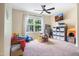 Bright playroom with a ceiling fan, lots of natural light, and toy storage at 6 Beaver Creek Lane Ln, Durham, NC 27703
