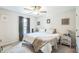 Bedroom features a ceiling fan, window with curtains, and warm, neutral décor at 647 N Hardee St, Durham, NC 27703