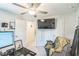 Well-lit bedroom with ceiling fan and attached office space with computer setup at 647 N Hardee St, Durham, NC 27703