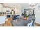 Open floor plan with modern kitchen that flows into the dining and living area at 647 N Hardee St, Durham, NC 27703