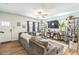Inviting living room with a plush sectional sofa, wood-look floors, and a view of backyard at 647 N Hardee St, Durham, NC 27703