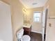 Half-bathroom with toilet, vanity, and dark wood flooring at 650 Ganyard Farm Way # 41, Durham, NC 27703