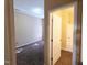 Bedroom leading into an ensuite bathroom featuring neutral walls and carpeted floors at 650 Ganyard Farm Way # 41, Durham, NC 27703