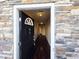 Inviting entryway features a stone accent wall, and dark hardwood floors and leads into a spacious hallway at 650 Ganyard Farm Way # 41, Durham, NC 27703