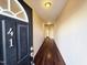 Well-lit entryway with dark hardwood floors leads to additional rooms in the home at 650 Ganyard Farm Way # 41, Durham, NC 27703