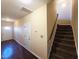 Inviting foyer with hardwood floors, neutral walls, and staircase leading to the upper level of the home at 650 Ganyard Farm Way # 41, Durham, NC 27703