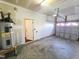 Spacious garage includes a water heater, door to the interior, and an automatic door opener at 650 Ganyard Farm Way # 41, Durham, NC 27703