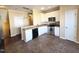 Kitchen with stainless steel appliances, white cabinets, granite countertops and tile flooring at 650 Ganyard Farm Way # 41, Durham, NC 27703