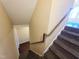 View from the top of the carpeted staircase looking down into the lower level of the home at 650 Ganyard Farm Way # 41, Durham, NC 27703